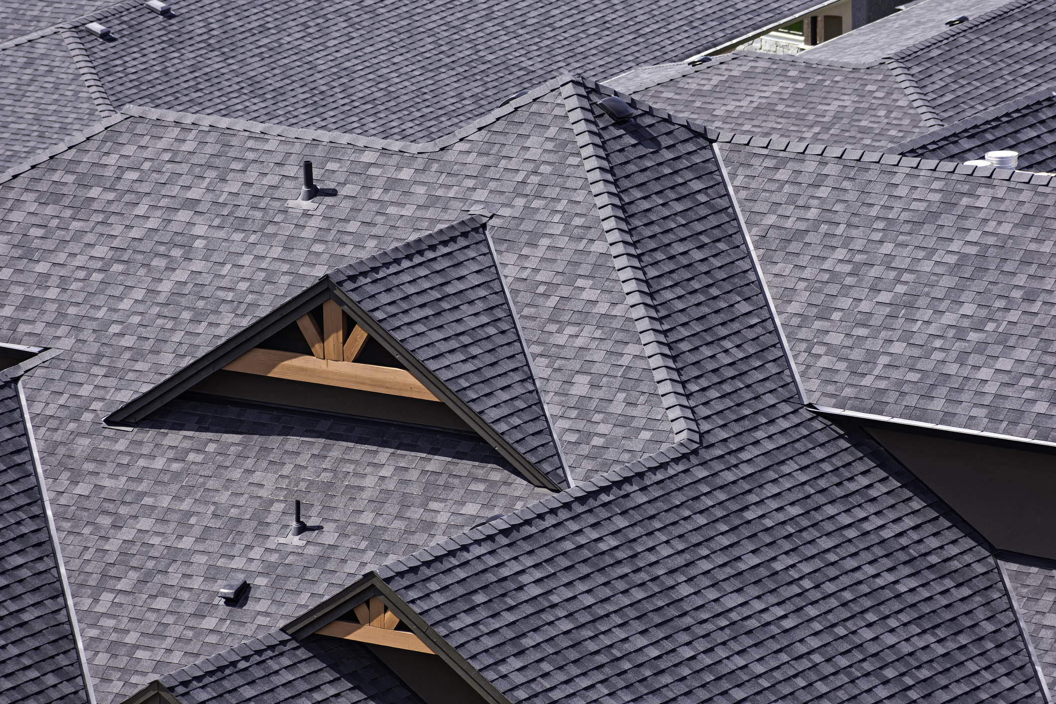 Rooftop in a newly constructed subdivision showing asphalt shingles